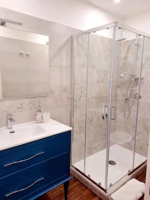 a bathroom with a shower and a sink at Clara Bedda in Palermo