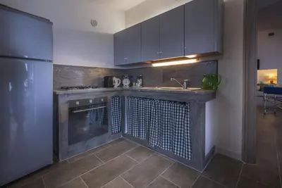 a kitchen with a sink and a counter top at Chalet Le Palmette in Contrada Sauci Grande