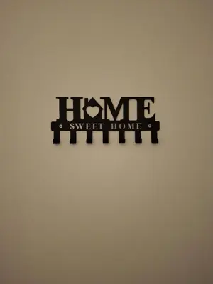 a sign that reads home sweet home on a wall at Compa House - Palermo Center in Palermo
