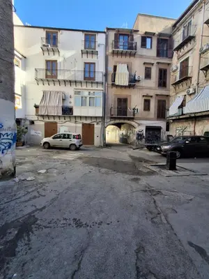 an empty parking lot in front of a building at Compa House - Palermo Center in Palermo