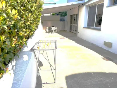 a glass table sitting on the side of a building at Home Sicilia in Carini