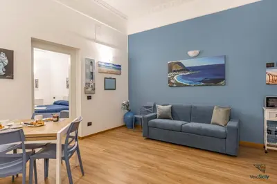 a living room with a couch and a table at Al Mondellu apt Verosicily in Palermo