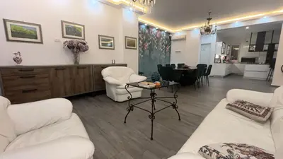a living room with two white couches and a table at Vanila Dream's House in Palermo