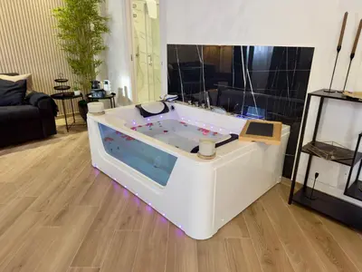 a jacuzzi tub filled with water with blue lights at Montana Suite in Palermo