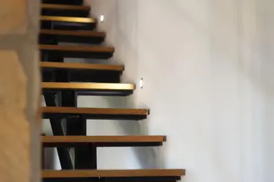 a set of stairs in a room with a white wall at Villa Adelaide in Cinisi