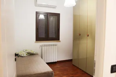 a room with a bed and a window and a radiator at Villa Adelaide in Cinisi