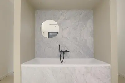 a bathroom with a sink and a mirror on a wall at Aloe -lounge and Jacuzzi- in Palermo