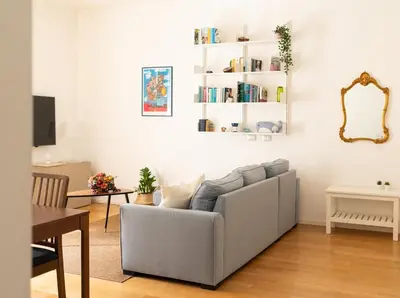 a living room with a couch and a table at The Nest Maqueda in Palermo