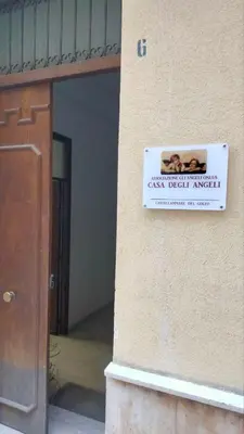 a sign on the side of a building at Casa degli Angeli Castellammare del Golfo TP Sicilia in Castellammare del Golfo