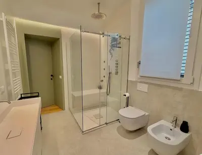 a bathroom with a shower and a toilet and a sink at Haus Mignon - Bright flat in Palermo Center in Palermo