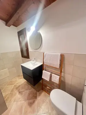 a bathroom with a sink and a toilet at RossoScirì in Calatafimi