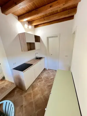 a kitchen with a sink and a counter top at RossoScirì in Calatafimi