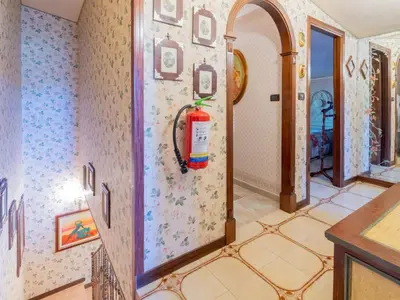 a bathroom with a sink and a toilet and a mirror at Casa San Nicola Trabia Mare in Trabia