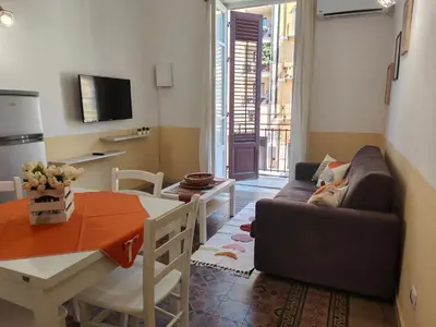 a living room with a couch and a table at Central Station Apartaments Casa Vacanze in Palermo