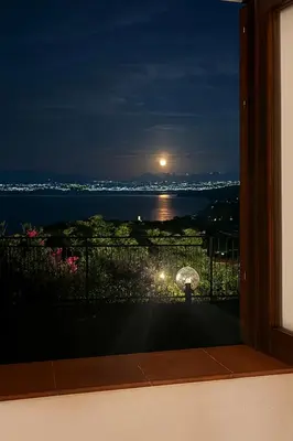 a view of the ocean at night from a balcony at Zingaro Anima Maris, tra Scopello e Lo Zingaro in Castellammare del Golfo