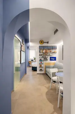 an archway leads into a living room with a couch and a table at PAT Amazing & Charm cozy apt in Palermo
