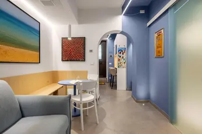 a waiting room with a table and chairs at PAT Amazing & Charm cozy apt in Palermo