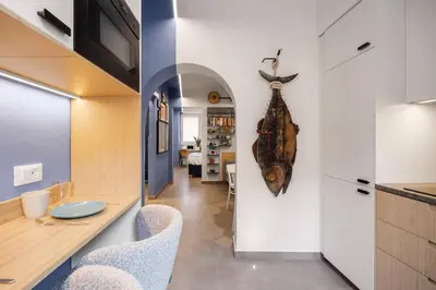 a kitchen and dining room with a table and chairs at PAT Amazing & Charm cozy apt in Palermo