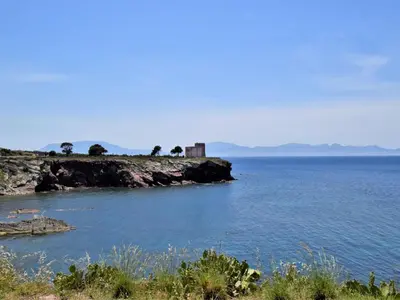 an island in the ocean with a building on it at Apartment Wohnung dei Mori in Terrasini by Interhome in Terrasini