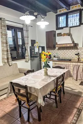 a living room with a table with flowers on it at Apartment Sea Living Sicilia Apartment by Interhome in Santa Flavia