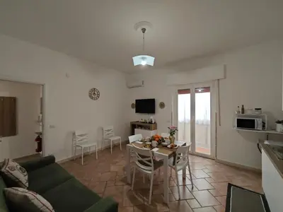 a living room with a couch and a table at Kennedy 100 in Capaci