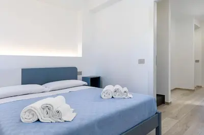 a bedroom with a bed with towels on it at A Casa Di Vale in San Vito lo Capo