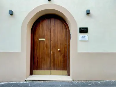 a wooden door on the side of a building at Gemy House in Palermo