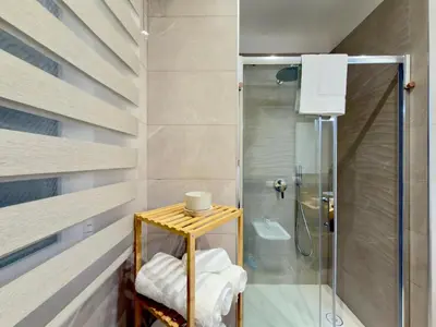 a bathroom with a shower and a toilet at Gemy House in Palermo