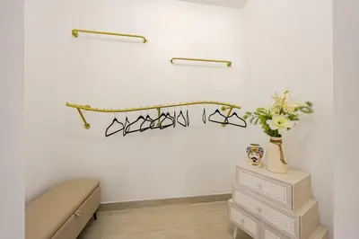 a room with a bed and a table with glasses on the wall at Angelica holiday home in Palermo