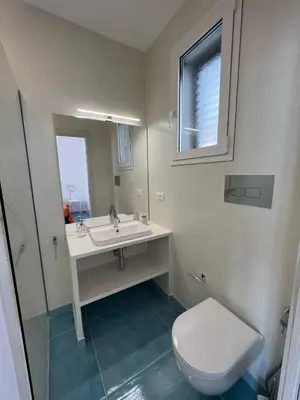 a bathroom with a sink and a toilet at Paradiso Isulidda in Macari