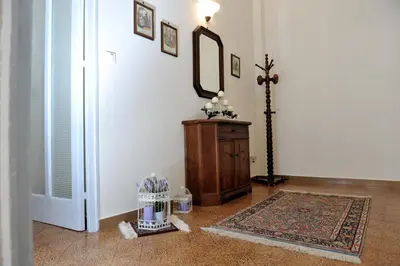 a room with a cross on the wall and a mirror at Case Vacanze Terra Sinus in Terrasini