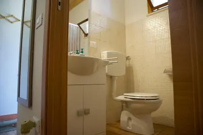 a bathroom with a toilet and a sink at Casa Vacanza e Camera Fabiola in Castellammare del Golfo