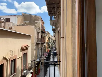 a view of an alley from a window of a building at Cialoma B&B in Palermo