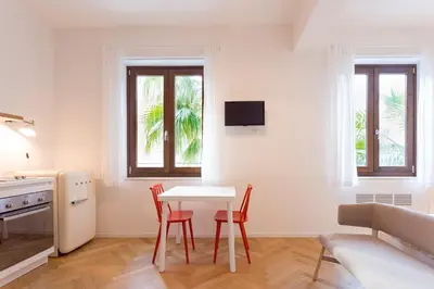 a kitchen and dining room with a table and chairs at Residence Itaca in Castellammare del Golfo