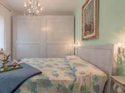 a bedroom with a bed with a blanket on it at Villa Jancaliva by Interhome in Cefalù