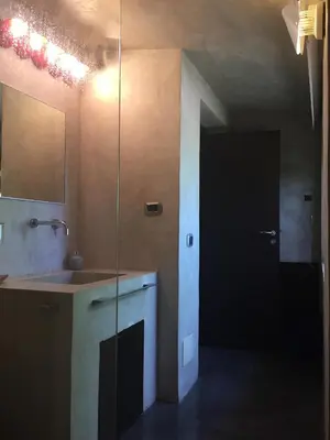 a bathroom with a sink and a mirror at Villa Il Cappero in San Vito lo Capo