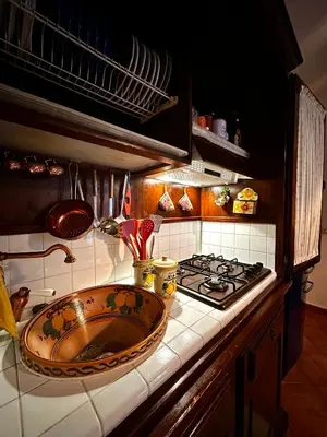 a kitchen with a sink and a stove at Casa Perciata - Locazione Turistica in Mondello