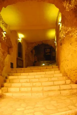 a staircase in a building with a stone wall at Casa Vacanze La Terrazza Sul Golfo in Castellammare del Golfo