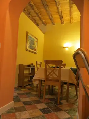a dining room with a table and chairs at Junior Suite Cattedrale in Palermo