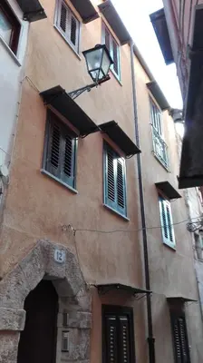 a building with windows and a street light on it at Junior Suite Cattedrale in Palermo