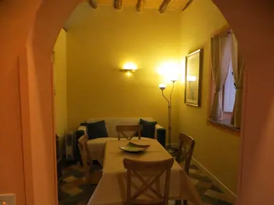 a dining room with a table and chairs in a room at Junior Suite Cattedrale in Palermo