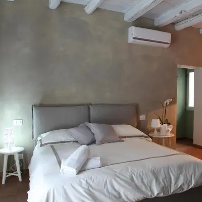 a bed with two pillows on it in a bedroom at Baglio San Giovanni in Palermo