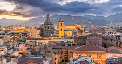 a cityscape of a city at sunset at Appartamento Delle Pergole in Palermo