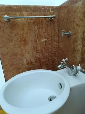 a bathroom with a white sink and a toilet at Olivella Suite Ecological House in Palermo