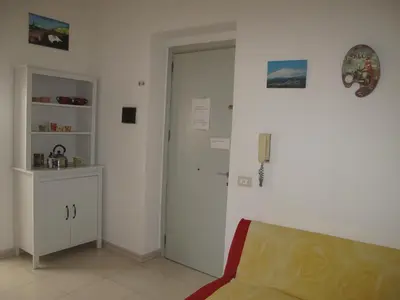 a living room with a couch and a door at Casa Il Papiro TRS-IT-SIC-20280 in Palermo
