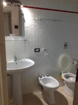a bathroom with a sink and a toilet at Casa Il Papiro TRS-IT-SIC-20280 in Palermo