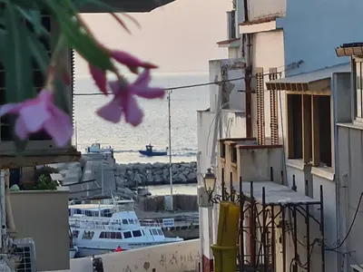 a view of a harbor with boats in the water at casa sul mare in Terrasini