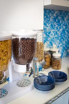 a kitchen counter with a food processor filled with nuts at Colors B&B in Palermo