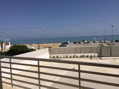 a view of a parking lot with a beach at Casa Vacanze Playa 54 in Castellammare del Golfo