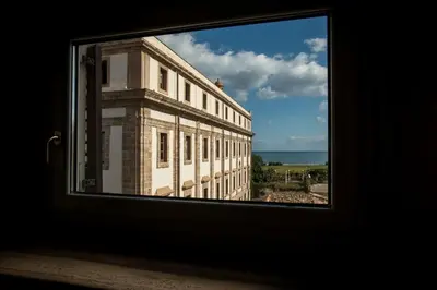 a view of a building from a window at Dimora Torremuzza in Palermo
